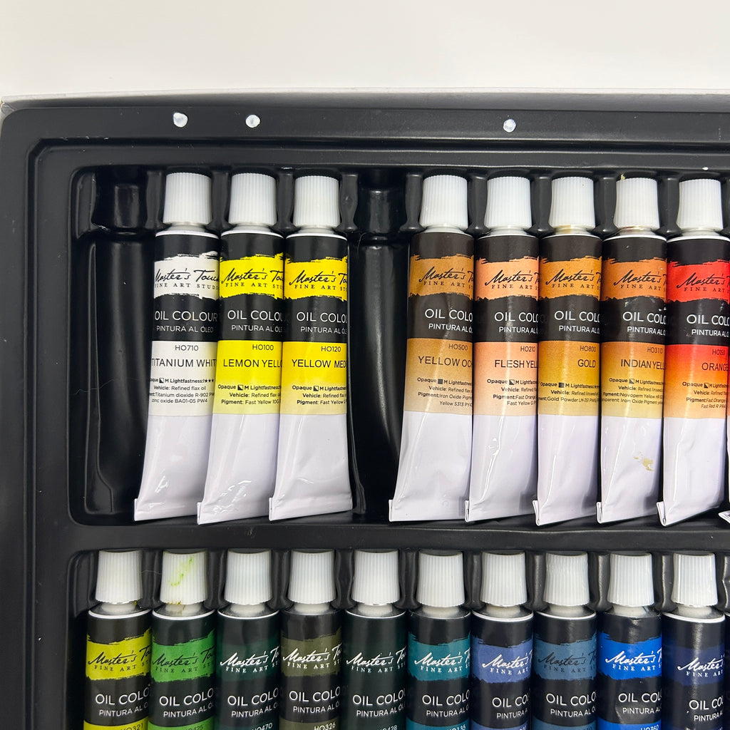 Set of Antoni oil paint tubes in a black storage case.
