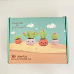 Crochet kit for beginners packaging with cartoon cacti on a desert background