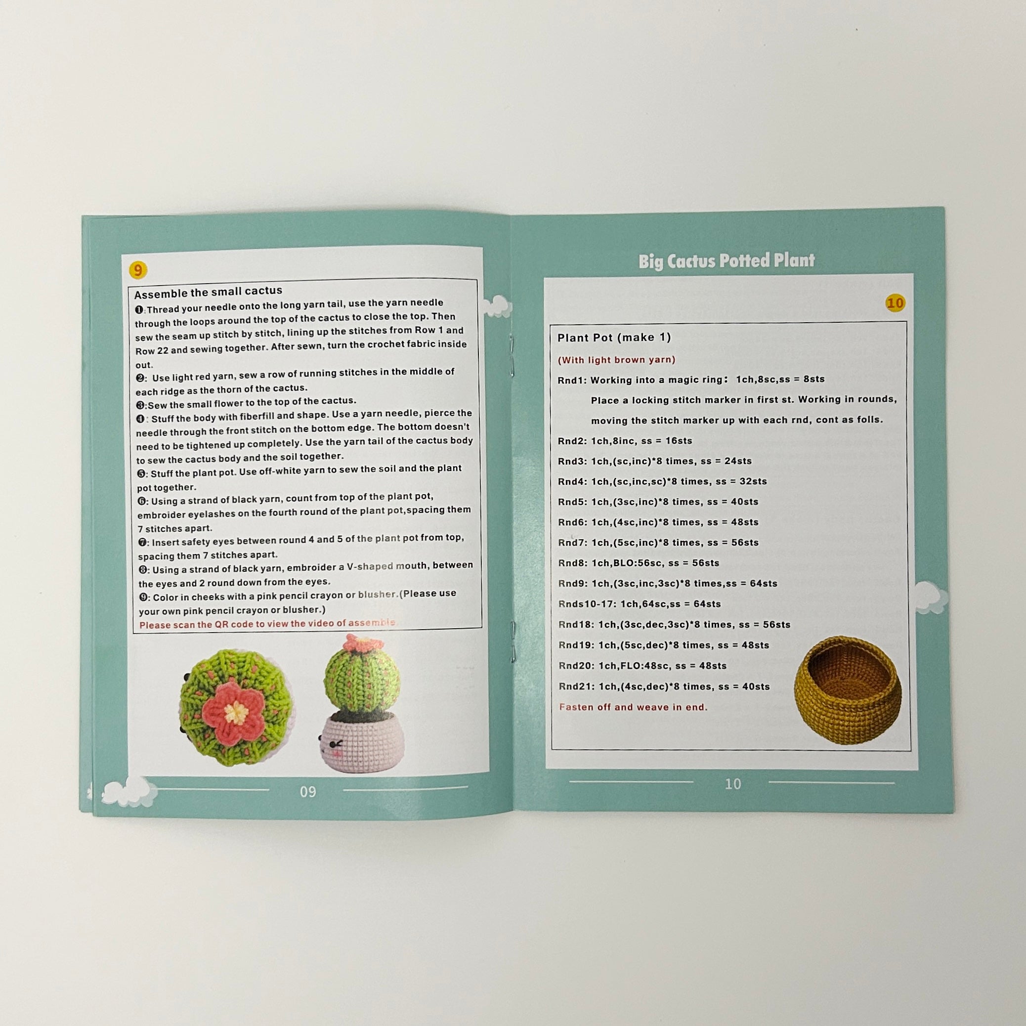 Open book with crochet patterns for a cactus plant and pot on a white background